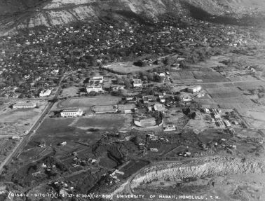 Aerial photograph, 6 January 1937, shows Andrews Amphitheatre, old Gilmore Hall, an expanded Pineapple Research Institute (now Krauss Hall), and Campus Gate. Dole Street runs from McCully area (beyond the left margin of photograph) to University Avenue. Note also the distance between the quarry edge and Andrews Amphitheatre. (University Archives Photograph OURD 227A)